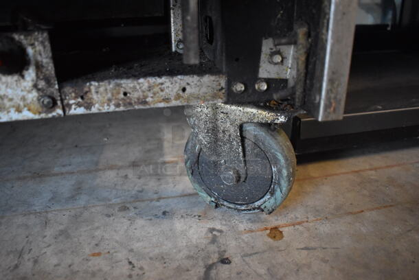 Bakers Pride Stainless Steel Commercial Natural Gas Powered 6 Burner Range w/ Oven, Over Shelf and Back Splash on Commercial Casters. Oven Door Does Not Stay Closed. 36x34x57 - Image 7 of 7