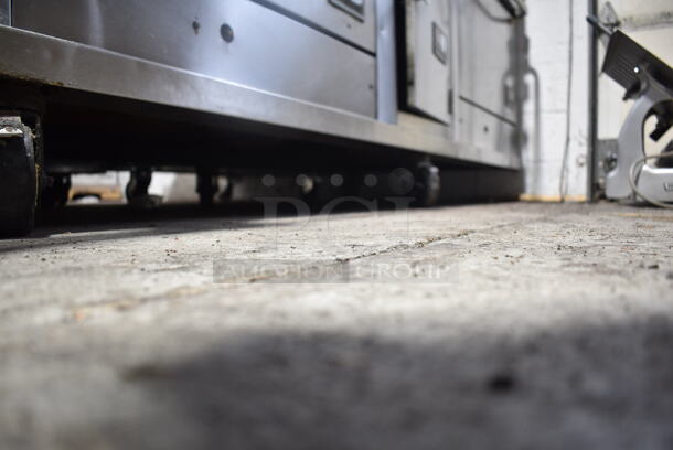 Southbend Stainless Steel Commercial Natural Gas Powered 6 Burner Range w/ Flat Top Griddle, 2 Ovens, Cheese Melter and Back Splash on Commercial Casters.  - Image 9 of 9