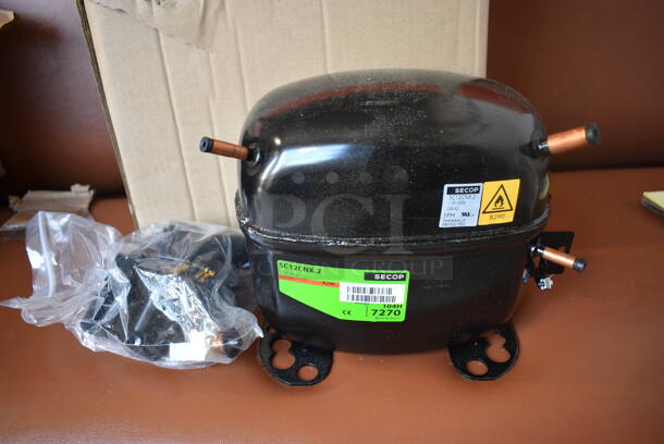BRAND NEW IN BOX! Secop Model SC12CNX.2 Metal Commercial Compressor. 115 Volts, 1 Phase. 9x6x8