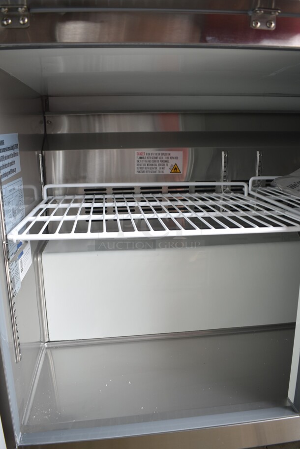 BRAND NEW SCRATCH AND DENT! 2024 Avantco 178AU48RHC Stainless Steel Commercial 2 Door Undercounter Cooler on Commercial Casters. 115 Volts, 1 Phase. Tested and Powers On But Does Not Get Cold - Image 5 of 6