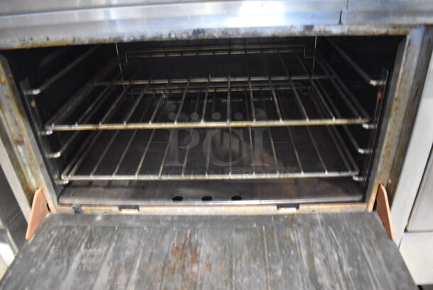 Garland Stainless Steel Commercial Natural Gas Powered 6 Burner Range w/ Flat Top Griddle, 2 Ovens, Over Shelf and Back Splash. 60x35x59.5 - Image 7 of 9