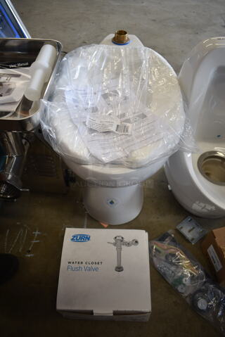 BRAND NEW SCRATCH AND DENT! White Toilet w/ Zurn Z5955SS-EL Toilet Seat and Zurn Flush Valve. 