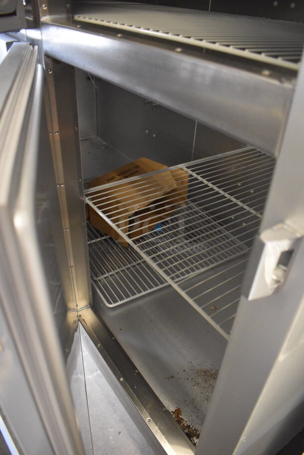 BRAND NEW SCRATCH AND DENT! Traulsen G31003 Stainless Steel Commercial 6 Half Size Reach In Door Freezer w/ Poly Coated Racks on Commercial Casters. 115 Volts, 1 Phase. 76x34x83. Tested and Working! - Image 5 of 8