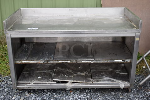 Stainless Steel Table w/ Back Splash and 2 Under Shelves on Commercial Casters. 56x27x36