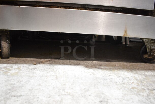 Vulcan V6B36S Stainless Steel Commercial Natural Gas Powered 6 Burner Range w/ Oven on Commercial Casters.  - Image 5 of 6