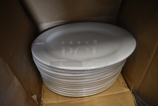 12 BRAND NEW IN BOX! Tuxton ALH-100 White Ceramic Oval Plates. 10x7.5x1. 12 Times Your Bid!