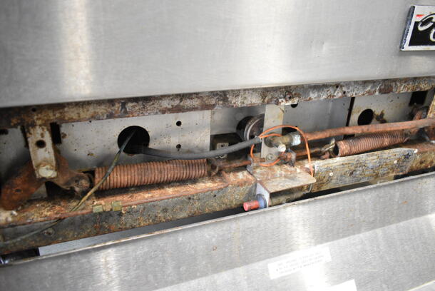 Garland M44R Stainless Steel Commercial Natural Gas Powered 4 Burner Range w/ Oven, Over Shelf and Back Splash on Commercial Casters.  - Image 7 of 9