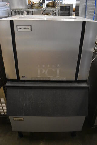 Ice O Matic Model CIM0330FA Stainless Steel Commercial Ice Machine Head on Commercial Ice Bin. 115 Volts, 1 Phase. 31x32x49