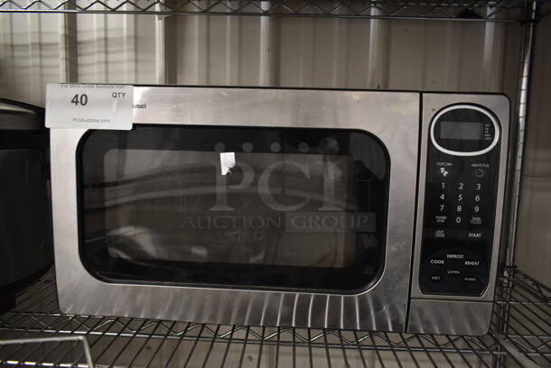 Sharp R-305KS Stainless Steel Countertop Microwave Oven. 120 Volts, 1 Phase. 