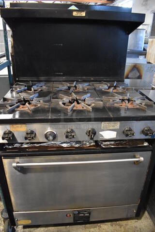 Comstock Castle C330 Metal Commercial Natural Gas Powered 6 Burner Range w/ Oven, Over Shelf and Back Splash. 35x32x59.5
