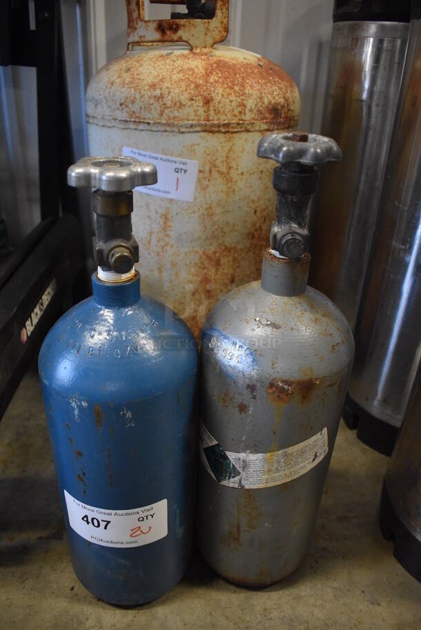 2 Metal Carbon Dioxide Tanks. 5x5x17.5. 2 Times Your Bid! Buyer Must Pick Up - We Will Not Ship This Item.  - Image 1 of 4