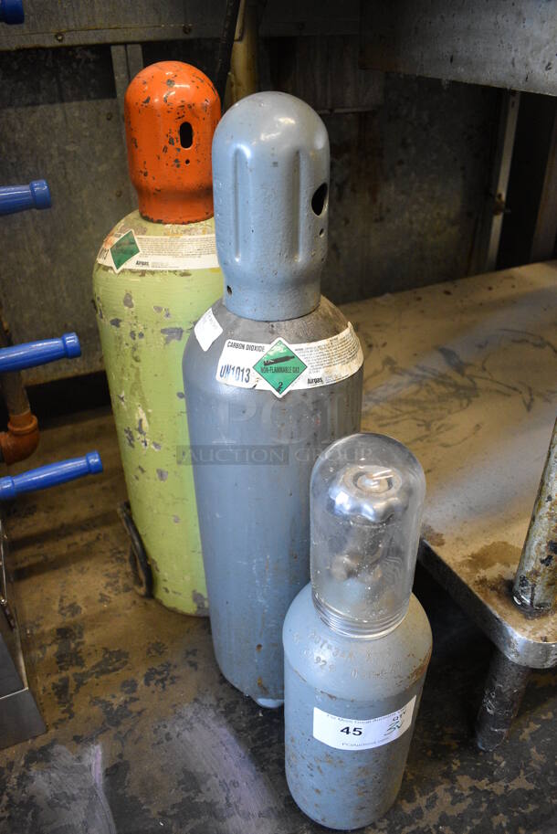 3 Various Carbon Dioxide Tanks. Includes 7x7x28. Buyer Must Pick Up - We Will Not Ship This Item. 3 Times Your Bid!