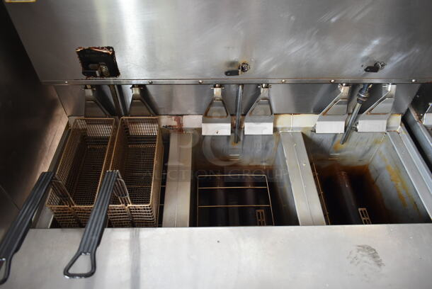 2016 Henny Penny OGA-323 ENERGY STAR Stainless Steel Commercial Natural Gas Powered 3 Bay Fryer w/ 4 Metal Fry Baskets on Commercial Casters. 255,000 BTU.  - Image 5 of 12