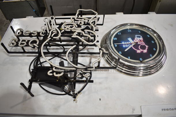 2 Light Up Items; Clock and Best BBQ Neon Sign. BBQ Tested and Working, Clock Does Not Power On. 2 Times Your Bid! Buyer Must Pick Up - We Will Not Ship This Item. - Image 1 of 5