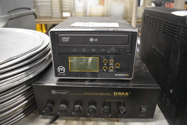 2 Various Items; LG Encompass XD CD Rom Player and Muzak DMA Digital Music Amplifier. 11x11x4, 7x8x4.5. 2 Times Your Bid!