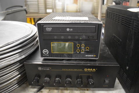 2 Various Items; LG Encompass XD CD Rom Player and Muzak DMA Digital Music Amplifier. 11x11x4, 7x8x4.5. 2 Times Your Bid!