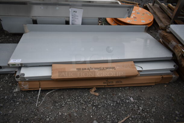 BRAND NEW SCRATCH AND DENT! Regency 600TB3072G 30" x 72" 18-Gauge 304 Stainless Steel Commercial Work Table with 4" Backsplash and Galvanized Undershelf - Image 2 of 6