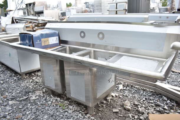 BRAND NEW SCRATCH AND DENT! Regency 600S21014216 54" 16-Gauge Stainless Steel Two Compartment Commercial Sink with Galvanized Steel Legs and Two Drainboards - 10" x 14" x 12" Bowls. No Legs.  - Image 3 of 9