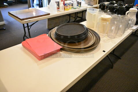 ALL ONE MONEY! Lot of Various Items Including Serving Trays and Poly Pitchers. Does Not Include Table. (main dining room)