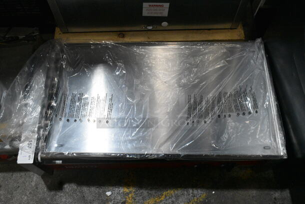 BRAND NEW SCRATCH AND DENT! 2024 Avantco 177RG1850NS Stainless Steel Commercial Countertop Hot Dog Roller. 120 Volts, 1 Phase. Tested and Working! - Image 5 of 6