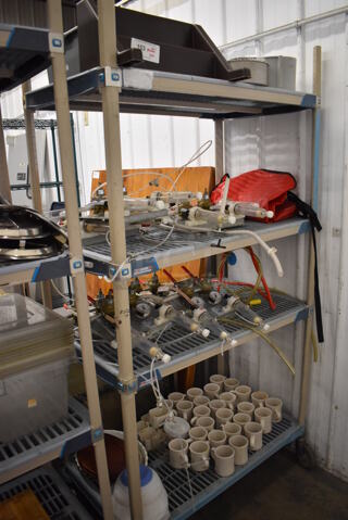 ALL ONE MONEY! Lot of 4 Tiers Worth of Various Items Including Food Processor Bowl, Ceramic Mugs and Gauges. Does NOT Include Shelving Unit