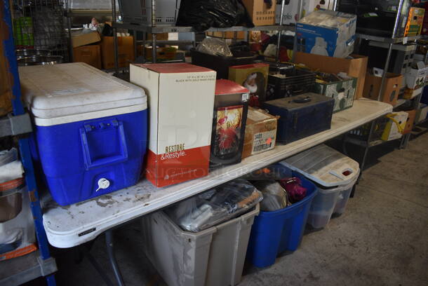 ALL ONE MONEY! Lot of Items On and Under Table Including Blue Poly Portable Cooler, Chinois Strainer, Clothing and Various Bins. Does Not Include Table. 96x30x30