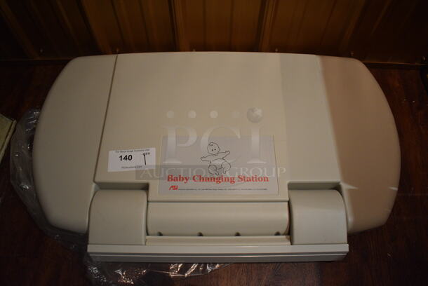 Tan Poly Wall Mount Diaper Changing Station. 34x3.5x21. (bar) - Image 1 of 3