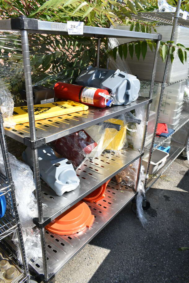 Chrome Finish 4 Tier Shelving Unit w/ Contents Including Fire Extinguisher, Wet Floor Caution Sign, Salad Spinner. BUYER MUST DISMANTLE. PCI CANNOT DISMANTLE FOR SHIPPING. PLEASE CONSIDER FREIGHT CHARGES. We Will Not Ship The Fire Extinguisher.  - Image 1 of 12