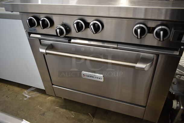 BRAND NEW SCRATCH AND DENT! 2023 Garland G36-6C Stainless Steel Commercial Floor Style Natural Gas Powered 6 Burner Range w/ Convection Oven, Over Shelf and Back Splash.  - Image 4 of 7