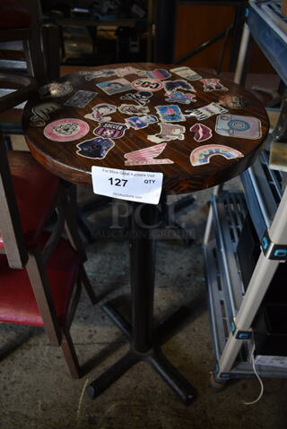 Wooden Round Bar Height Table on Black Metal Table Base.