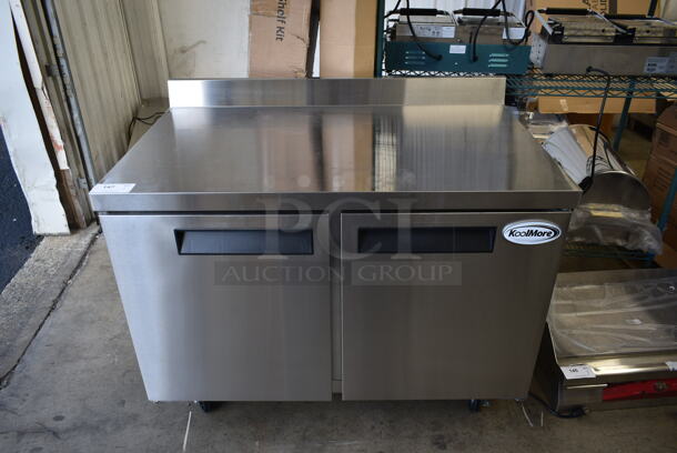 BRAND NEW SCRATCH AND DENT! 2023 KoolMore FWT-2D-12C Stainless Steel Commercial 2 Door Work Top Freezer w/ Back Splash on Commercial Casters. 115 Volts, 1 Phase. Tested and Working! - Image 1 of 8