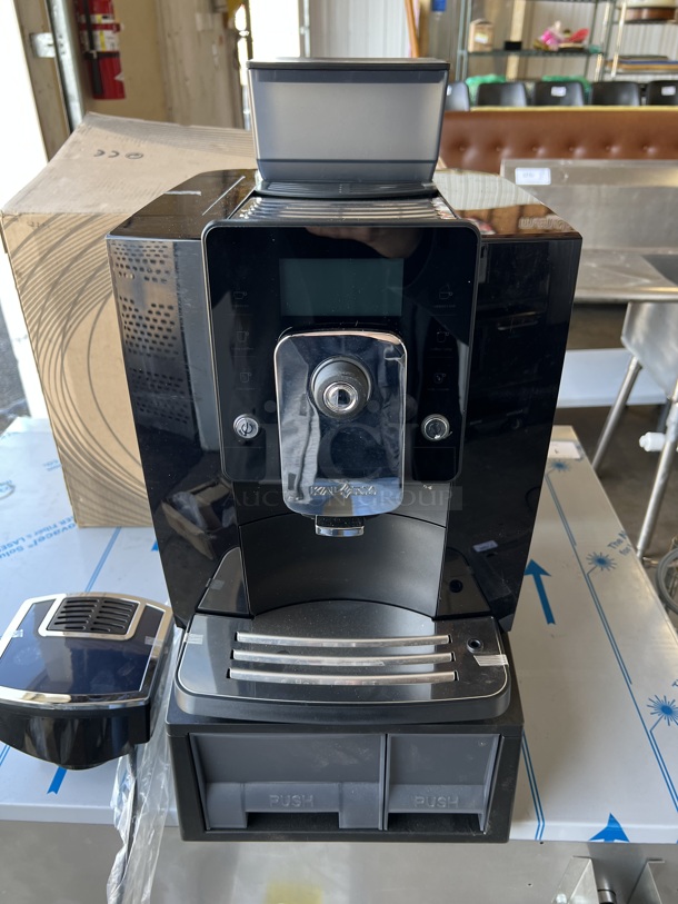 IN ORIGINAL BOX! LIKE NEW! Kalarm Model KLM1601PRO Black Poly Countertop Automatic Coffee Machine w/ 2 Lower Drawers and Hopper. 120 Volts, 1 Phase. 12x16x24
