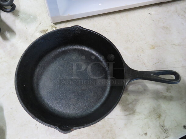 One 8 Inch Lodge Cast Iron Skillets. 