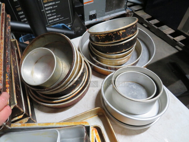 One Mega Lot Of Assorted Size Round Cake Pans.