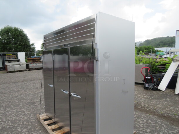 One WORKING 3 Door Stainless Steel Traulsen Refrigerator With 9 Racks, On Casters. 115 Volt. Model# G30011. 77X35X83.5. $9176.00. - Image 5 of 6