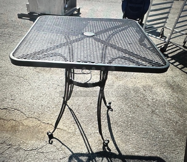One Black Metal Square Patio Table With Umbrella Hole. 28X28X28