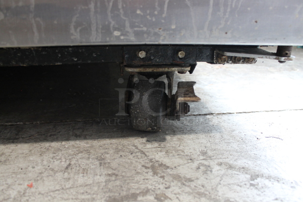 2014 True TG2R-2S ENERGY STAR Stainless Steel Commercial Two Door Reach In Cooler w/ Poly Coated Racks on Commercial Casters. 115 Volts, 1 Phase. Tested and Working! - Image 6 of 9