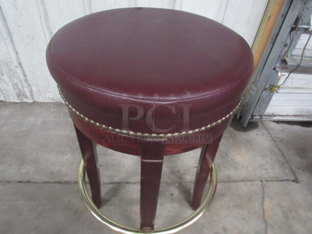 Wooden Bar Stool With A Red Cushioned Seat With Nail Head Trim And Footrest. 2XBID