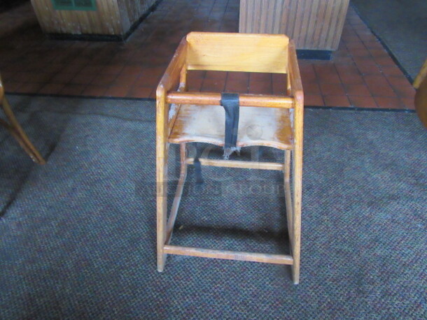 One Wooden High Chair.