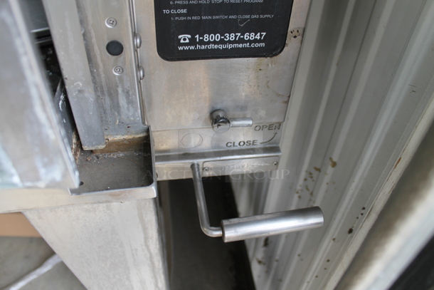 Hardt Model Inferno 3500 Stainless Steel Commercial Natural Gas Powered Rotisserie Oven on Metal Legs w/ Commercial Casters. Oven Has a 40 Bird Capacity. 50x46x39 - Image 3 of 6