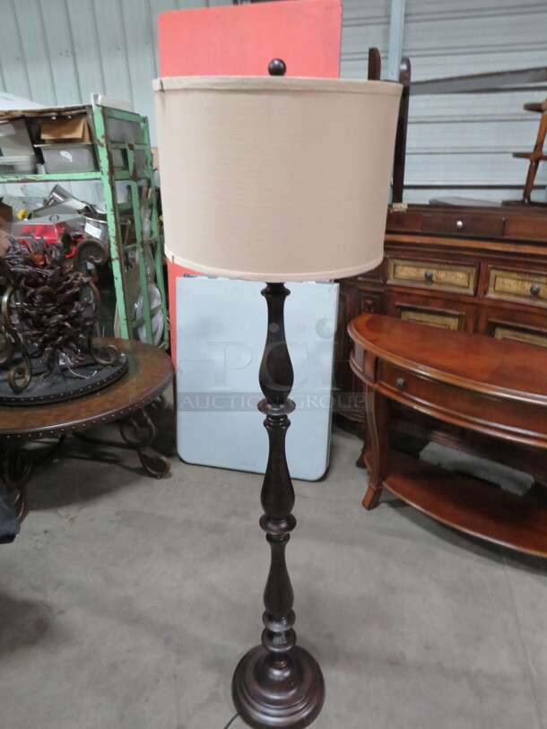 One Wooden Floor Lamp With Shade.
