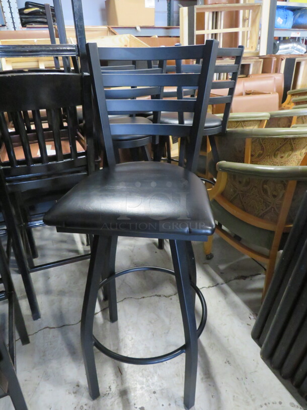 One Black Metal Bar Height Chair With A Swivel Black Cushioned  Seat. 