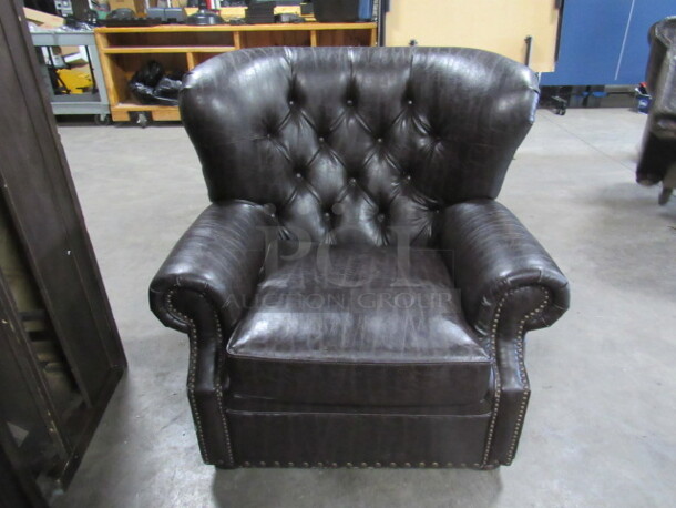 One AWESOME Brown Leather Look Over Stuff Chair. VERY COMFY