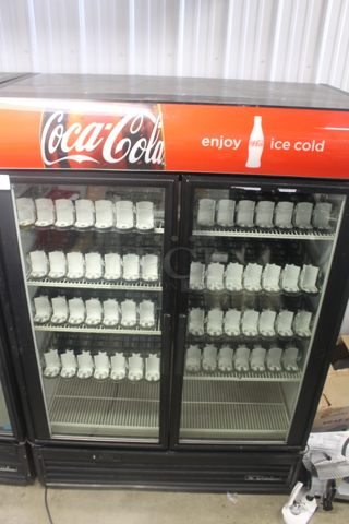 2012 True GDM-49EM Metal Commercial 2 Door Reach In Cooler Merchandiser w/ Poly Coated Racks. 115 Volts, 1 Phase. Tested and Powers On But Does Not Get Cold