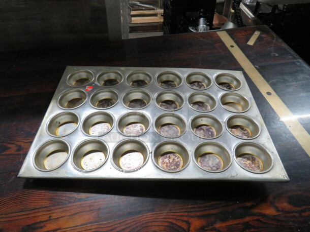 One Commerical 24 Hole Muffin Pan.