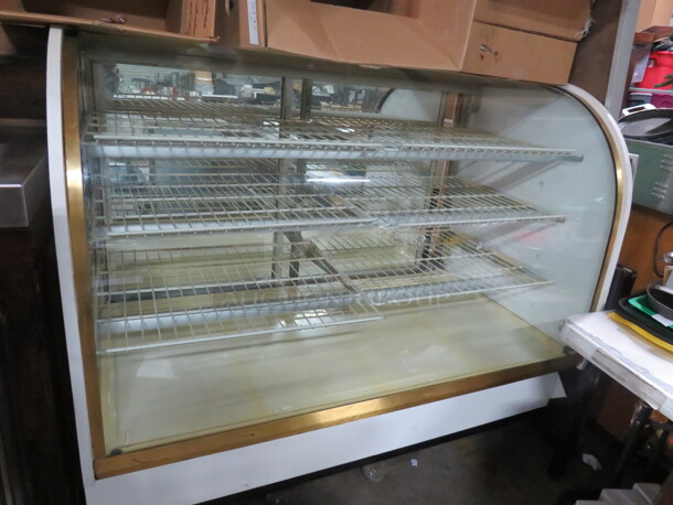 One Columbus Curved Glass Dry Bakery Case With 3 Shelves And 6 Racks. 61X35X50.
