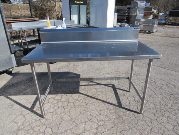 One Stainless Steel Table With Back Splash. 60X30X44