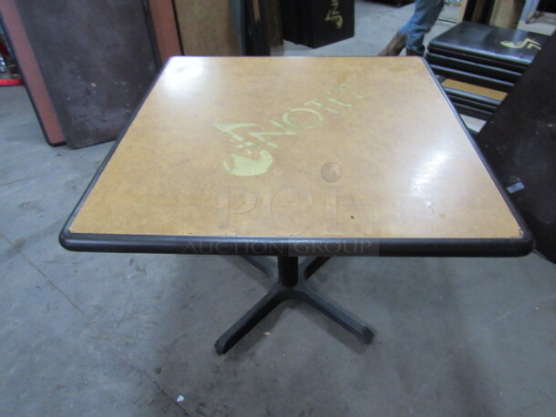 One Beige Table Top With The NOTES Logo On A Pedestal Base. 36X36X30