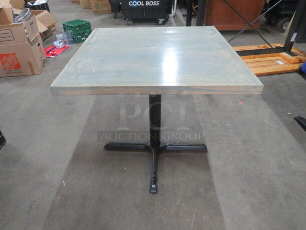 One Wooden Table Top In A Grey Finish On A Pedestal Base. 32X32X29