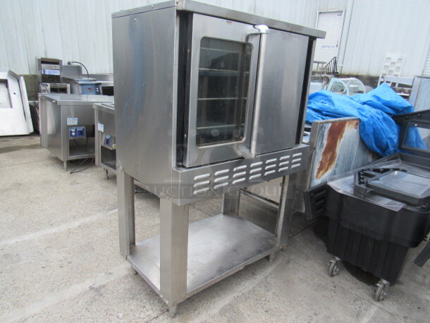 One Majestic American Range  Full Size Natural Gas Convection Oven With 4 Racks, On A SS Equipment Stand With Under Shelf, On Casters. Missing 1 Knob. 40X30X64 - Image 2 of 4